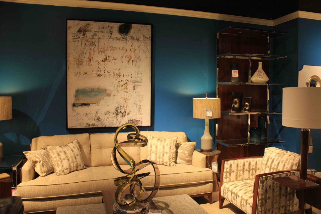 tan living room set with blue wall